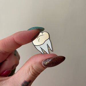 Gold tooth enamel pin